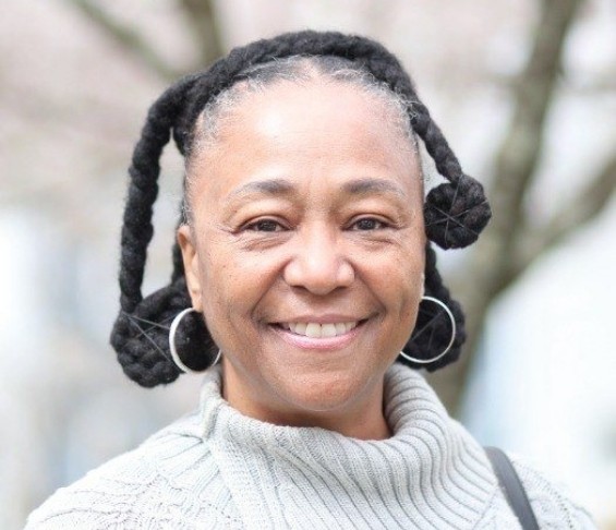 Smiling older woman in white sweater