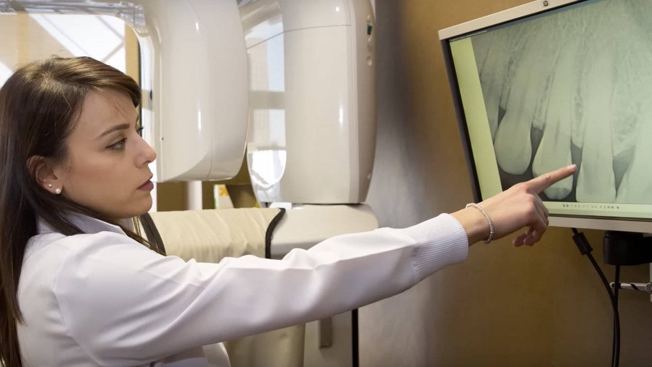 Man and woman in white lab coats looking at the camera