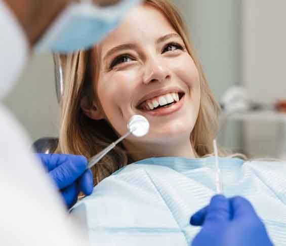 Lady smiles at dentist